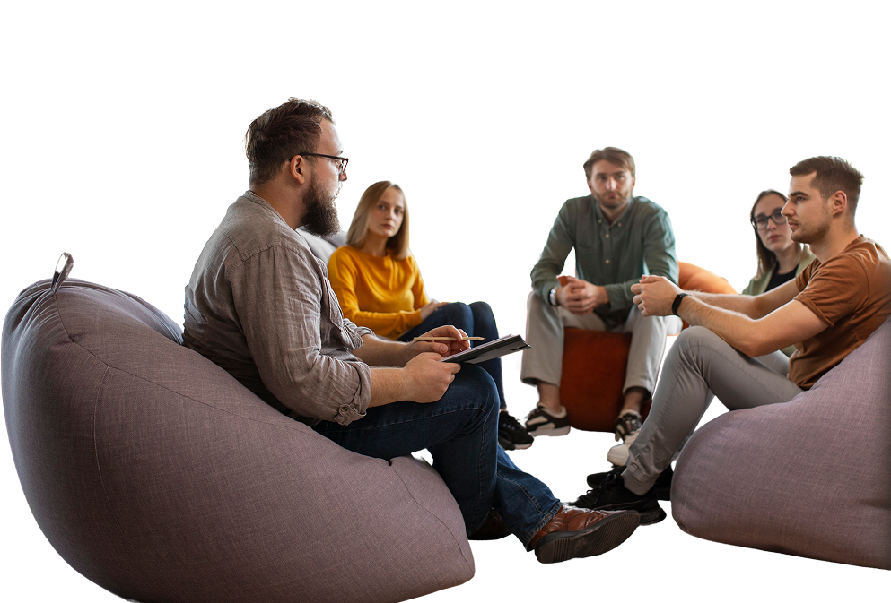Team members discussing in a casual bean bag setting